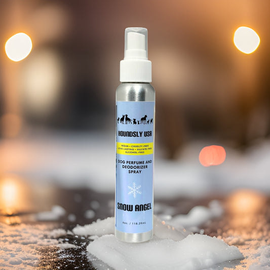 Snow Angel Dog Perfume Spray sitting outside in the slow with glowing lights
